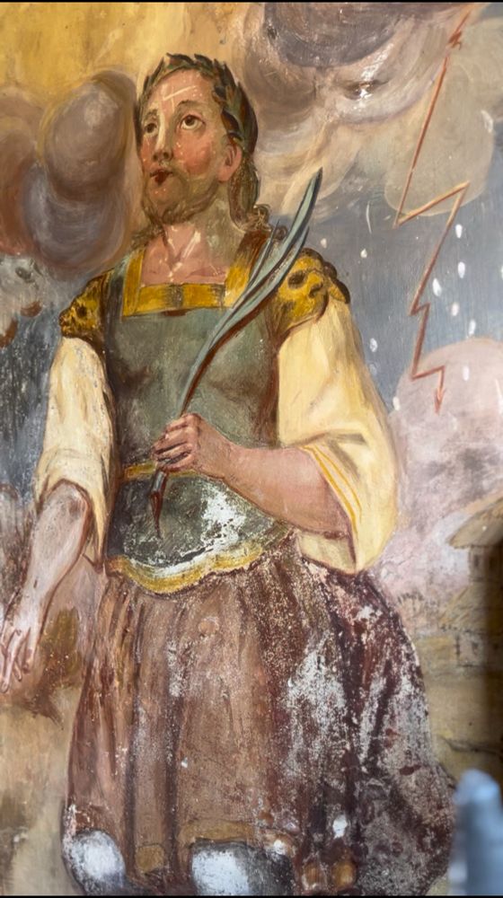 Fresco showing St Oswald kneeling and holding a martyr's palm with a threatening sky and thunder and snow in the background. From a wayside shrine in Sankt Oswald, Bad Kleinkirchheim, Austria