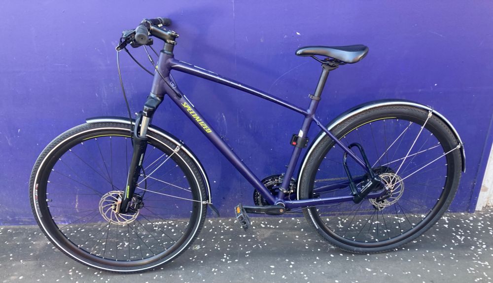 My bike against a chemist wall which both are painted aubergine (or maybe not quite as dark).