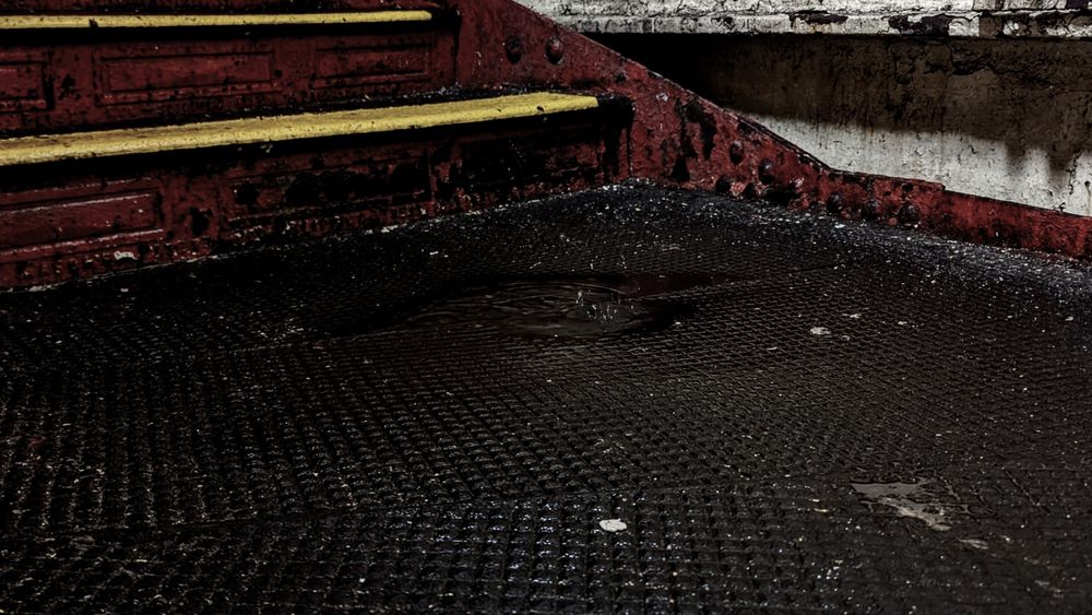 Puddle on stairs at EXR