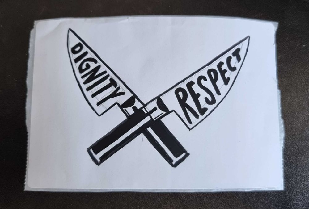 A sticker with two large kitchen knives crossed. One has "dignity" written on the blade, the other has "respect" written on it. 