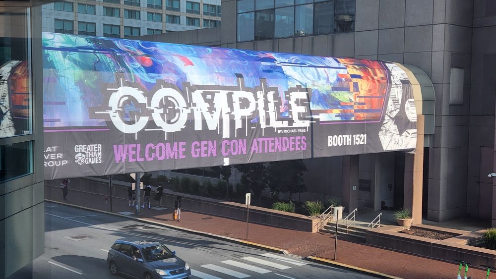 An advertisement for Compile, a game debuting at Gen Con 2024, covering the skywalk between buildings.