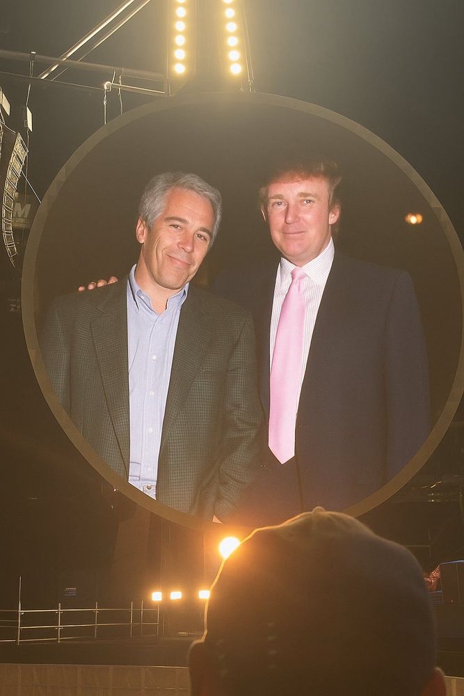 That Coldplay gig round video screen except instead of that married CEO and the lass he is banging, it’s everyone’s least favourite US president with his arm round Jeffrey Epstein