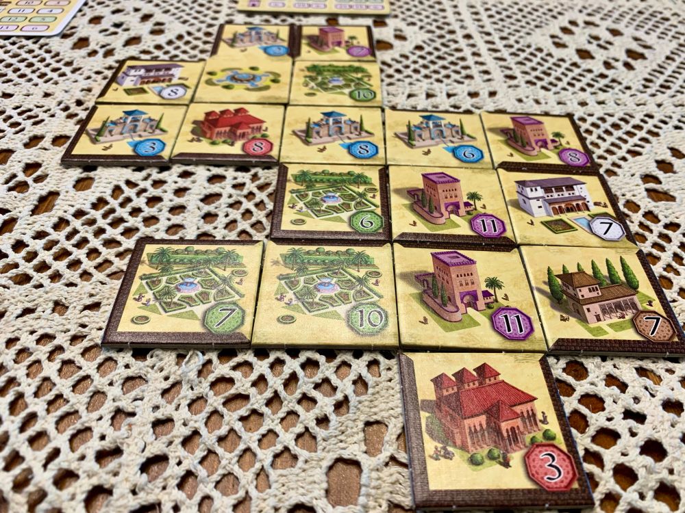Tiles to the game Alhambra set up in a little city.