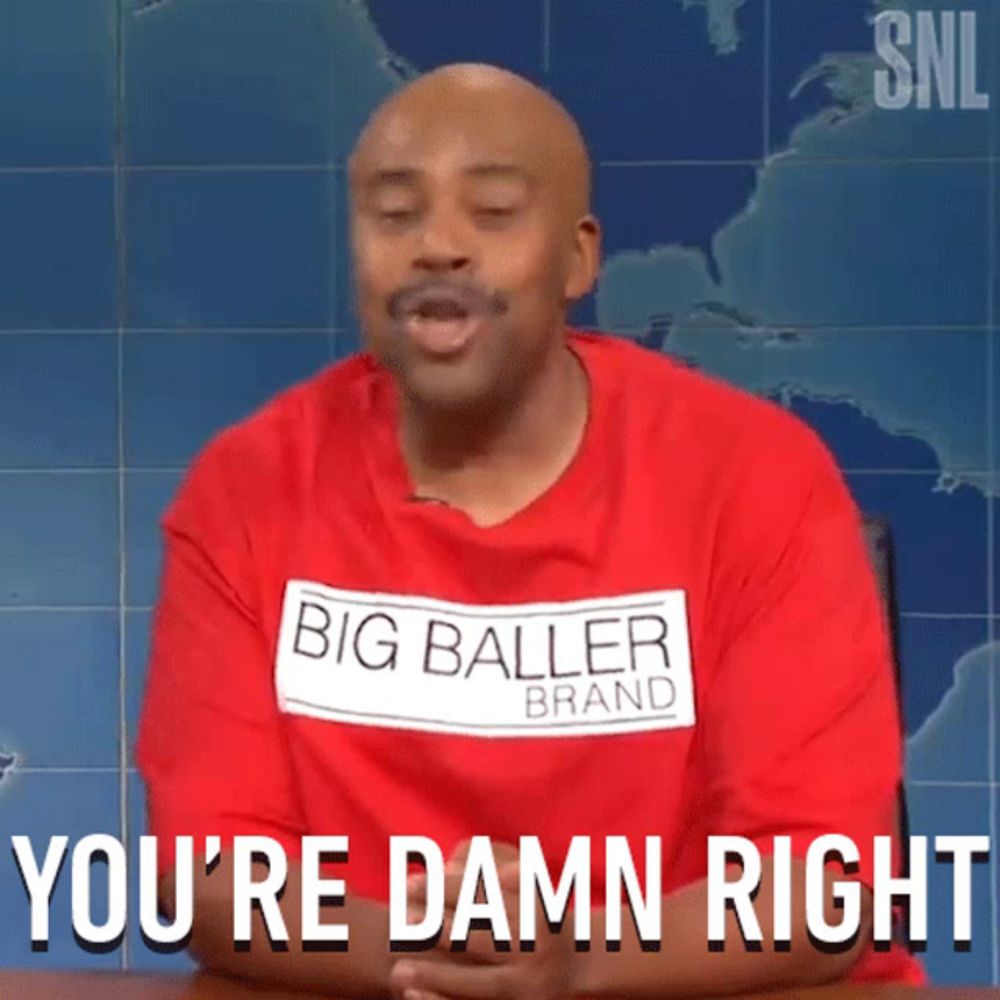 a man wearing a red shirt that says big baller brand is saying you 're damn right