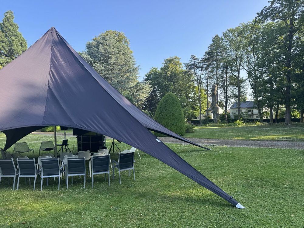 View of the garden with a tent where the meetup took place.
