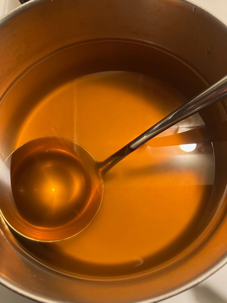 Pot of strained sumac-ade: The flavor from the berries (or blossoms) infuses into the water. It's sour and acidic like lemonade. Very refreshing.