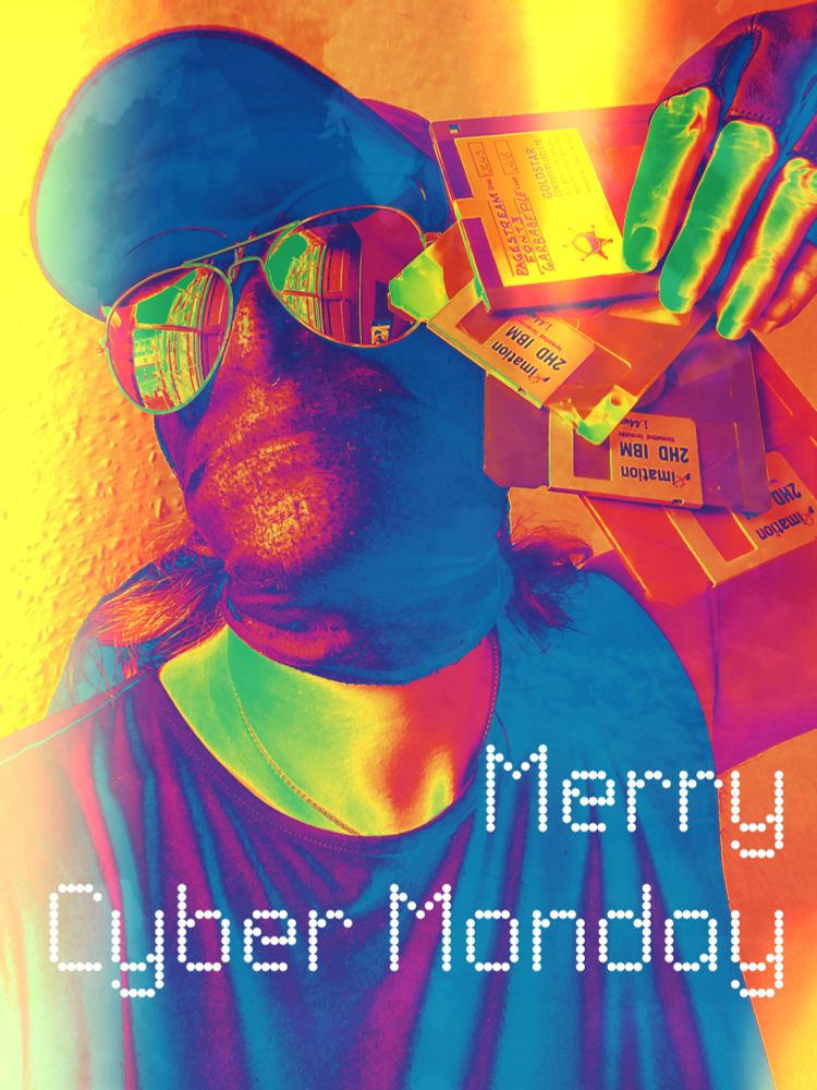 A Cyber Monday greetings card, where I am wearing mirror shades and fanning a handful of floppy disks.