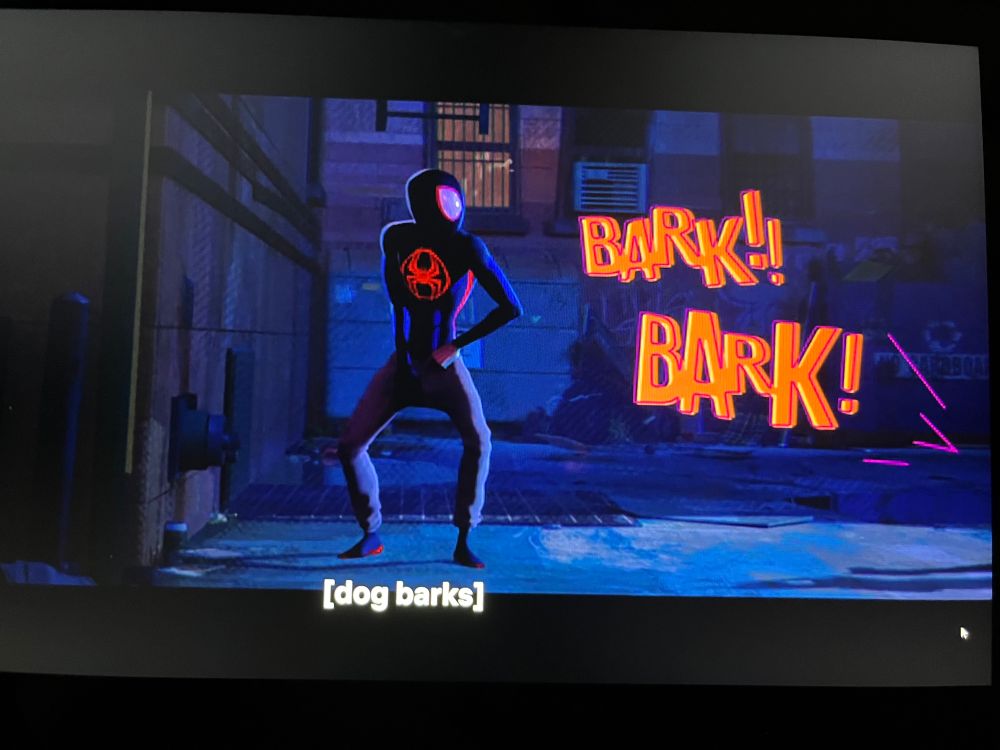 Miles Morales being barked at while fiddling with his fly