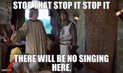 GIF of a scene from the movie ‘Monty Python and the Holy Grail’ where Michael Palin’s character, the King of Swamp Castle, declares “Stop that! Stop it! Stop it! There will be no singing here!”