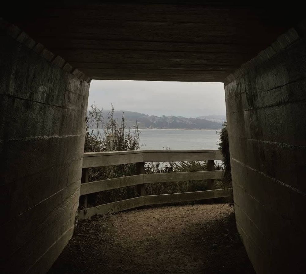 The view from inside the tunnel leading to the Point Bonita Lighthouse, located in the Marin Headlands at the entrance to the San Francisco Bay