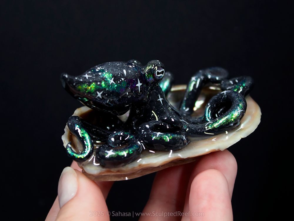 Mira the Nebula Octopus Sculpture, made from clay and lovingly painted in a green and gold on black Nebula theme 