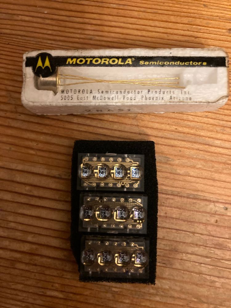 A boxed transistor above three 7 segment displays. 