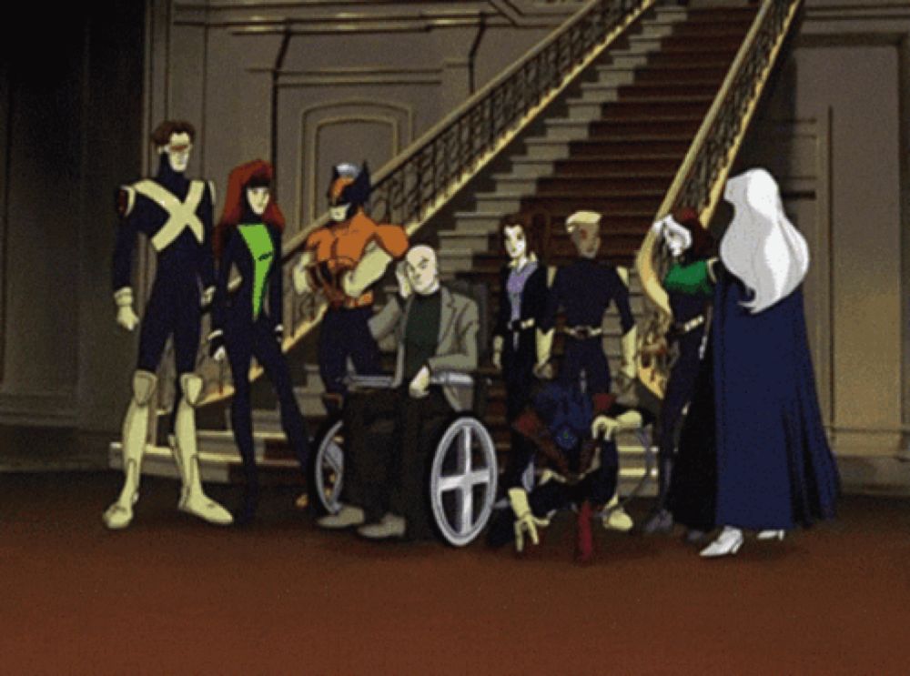 a group of x-men are posing for a picture in front of stairs