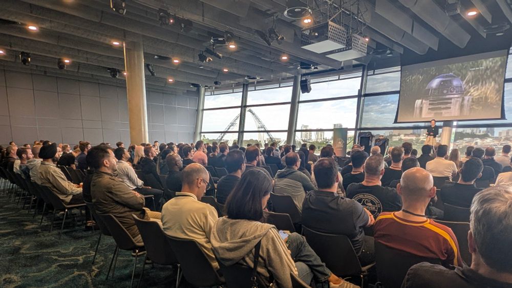 Packed room at a tech conference 