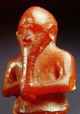 another small figure from Denmark, made of Amber holding a long plaited beard  
