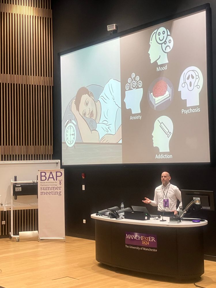 Scott presenting a slide linking some of the many mental health conditions linked to sleep. 