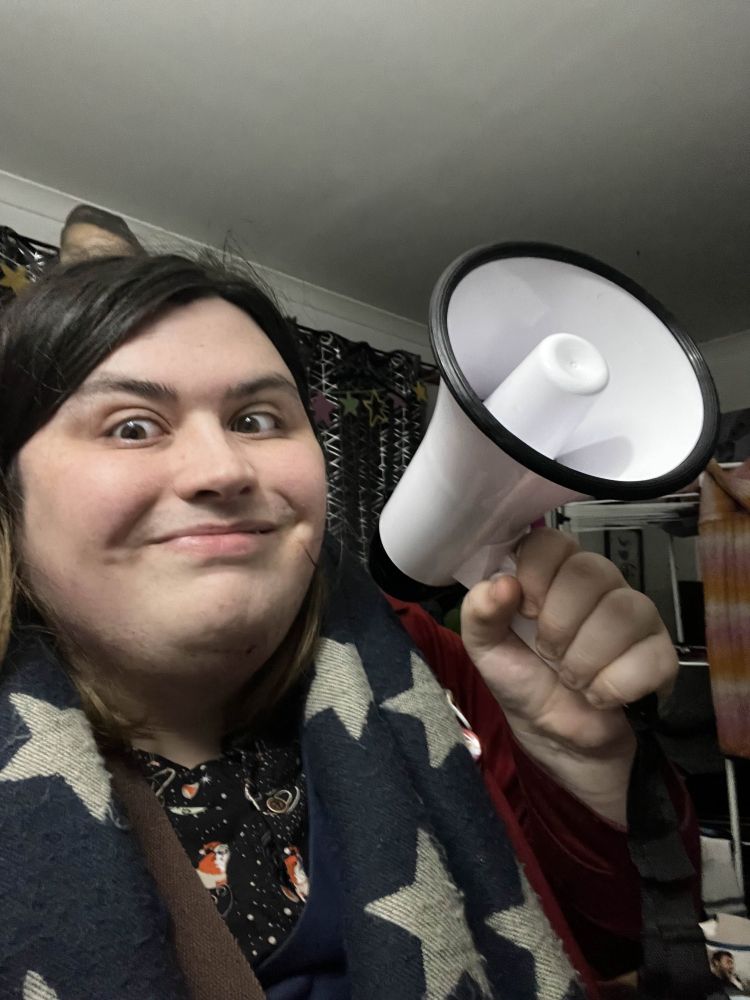 Star Craib-Leete looking very excited whilst holding onto a bullhorn.