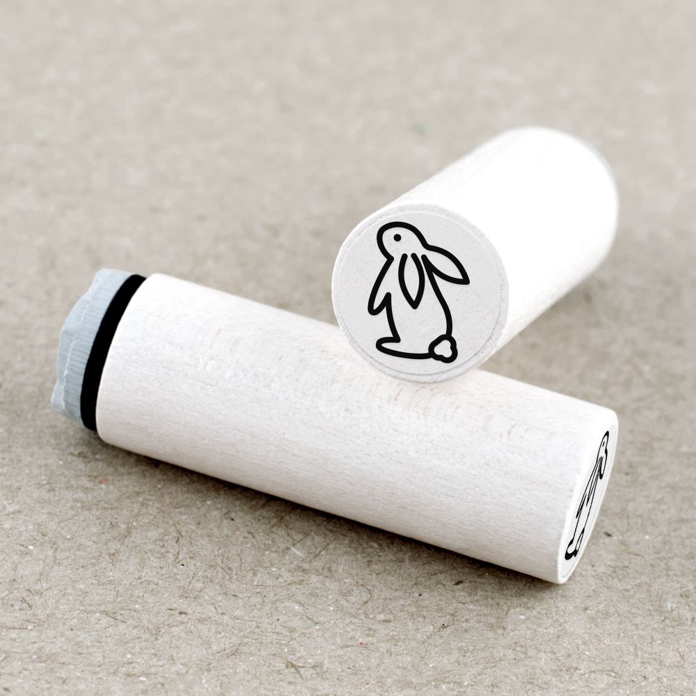 Round mini rubber stamp with the 'Rabbit' design. The rubber stamp is mounted on white lacquered maple wood, with a transparent label on top showing the motif. Perfect for bullet journals, planners or creative paper crafting!