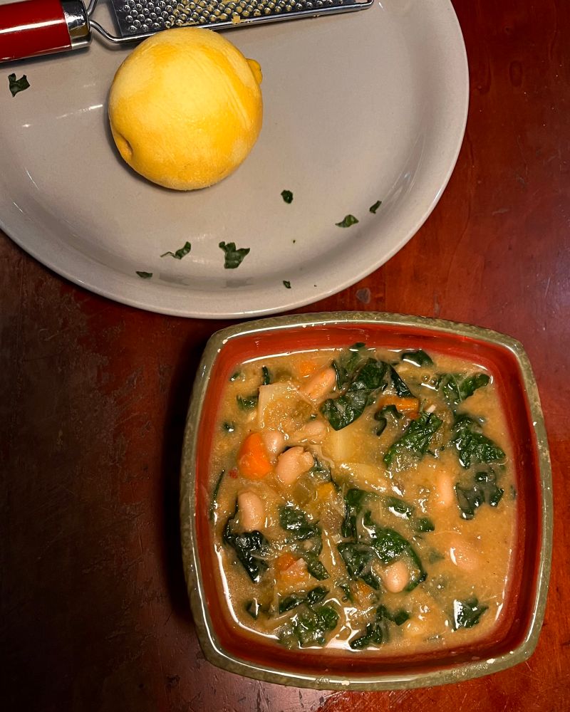 Cannellini bean and dino kale soup with carrots and artichoke hearts