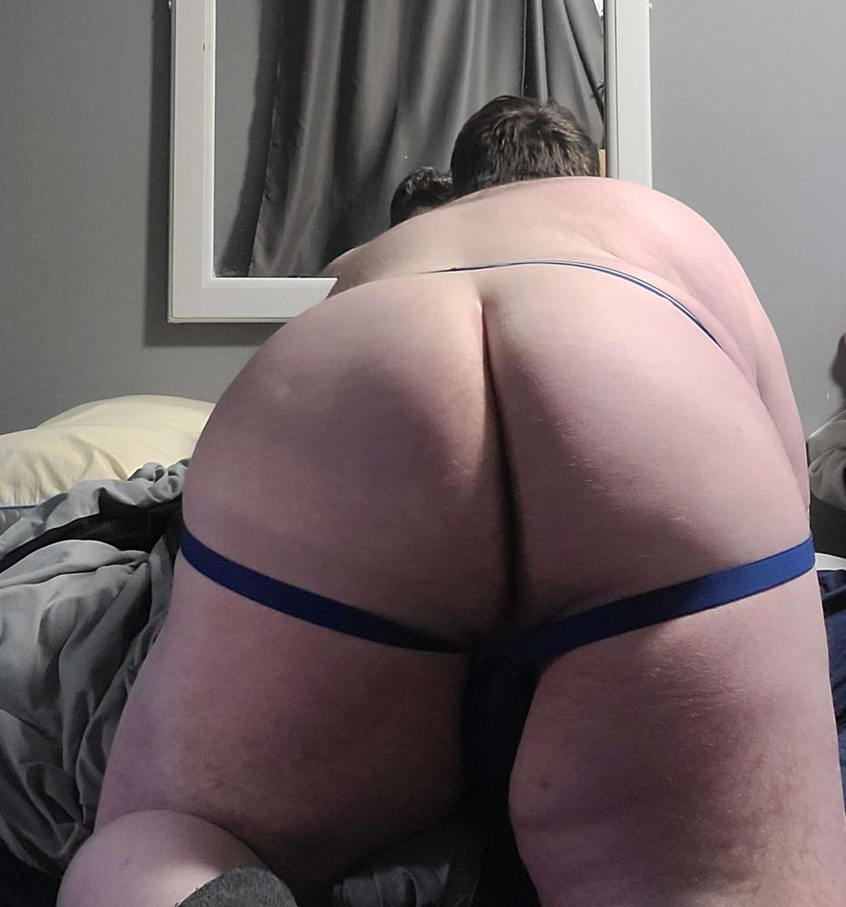 Big boy on hands and knees, showing butt with Jockstrap