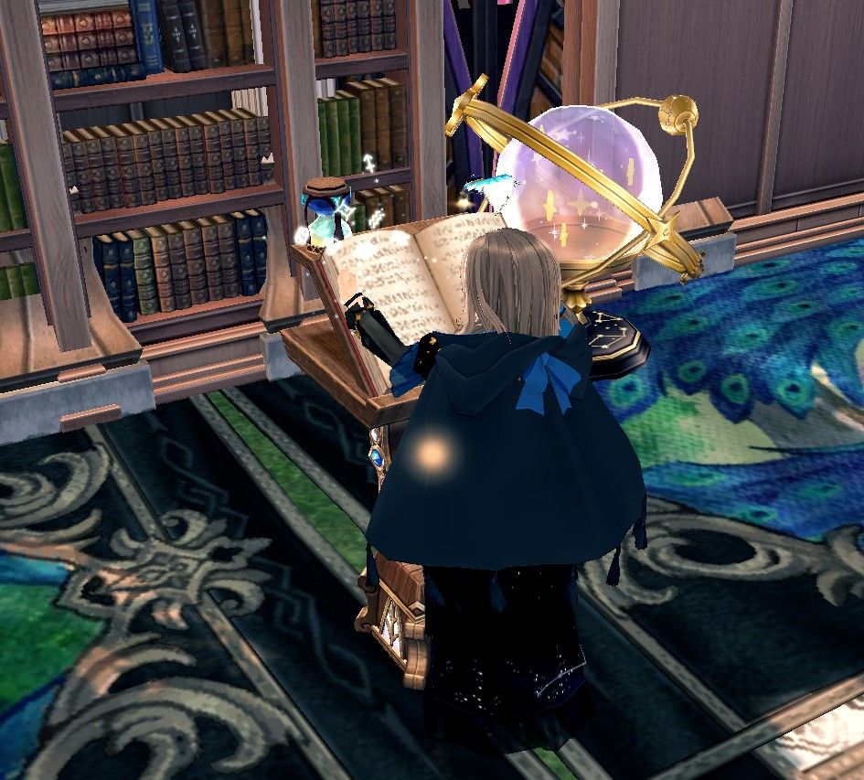 A long- brown-haired woman, who wears an ornate constellation dress, dark blue and black, has a half-moon cloak with a lighter blue ribbon on the hood. She looks into an ornate big grimoire with rune-like writing, the woman summons the zodiac symbols in the air,  while a magic quill writes in the book. Her surroundings are a room covered with bookcases, carpets of peacocks, the grass peaking through (The room is built in a homestead on Mabinogi), an Astrolobe of celestial stars next to a Halloween-themed stained glass window (It's a Halloween door, but stationed between bookcases makes it look like a tall window) Screenshot and Atl text by LadyLuette