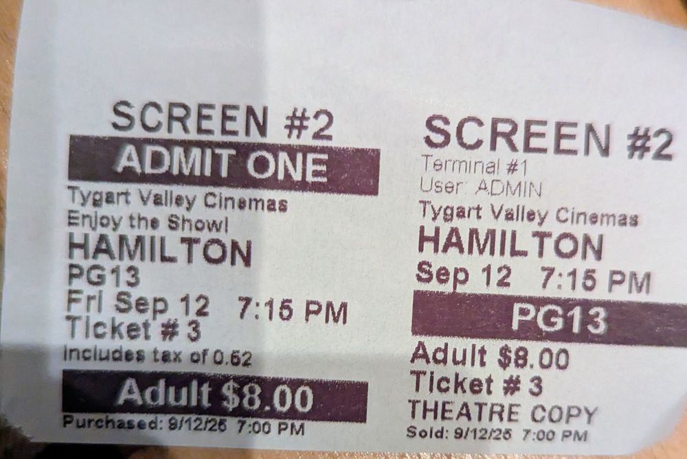 Black and white ticket stub for the movie version of Hamilton. 
