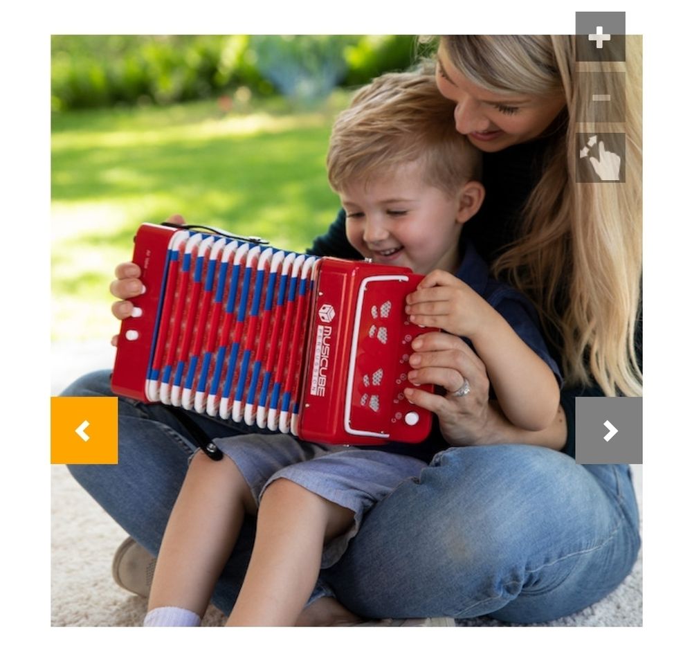 Preschool-aged boy, sitting peacefully and happily in his mother's lap, playing with said toy accordion. The mother also looks happy. Is this an alternate universe? Listing does not specify.
