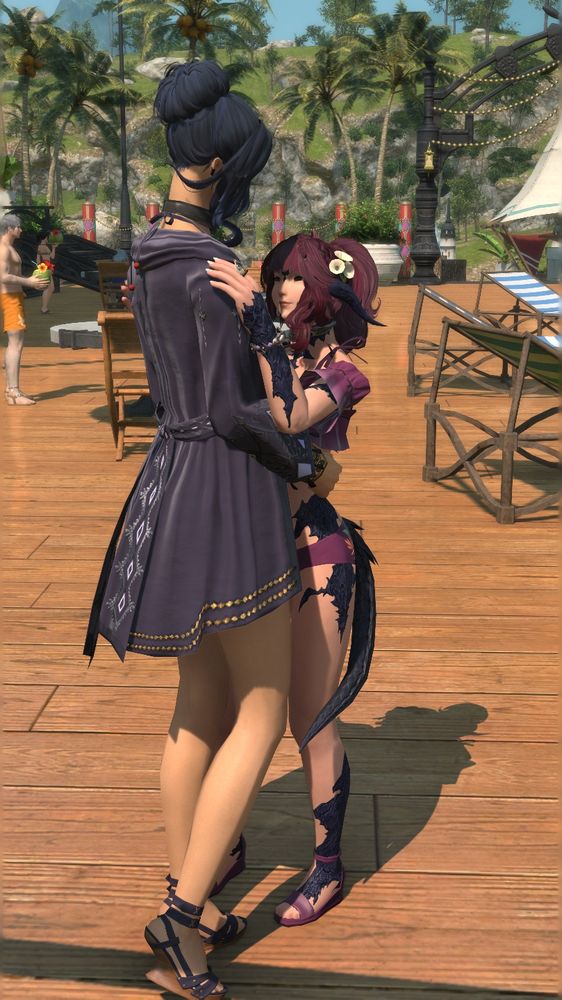 Aria and Celine hugging and dancing, the camera is posed to see Celine's smiling face.