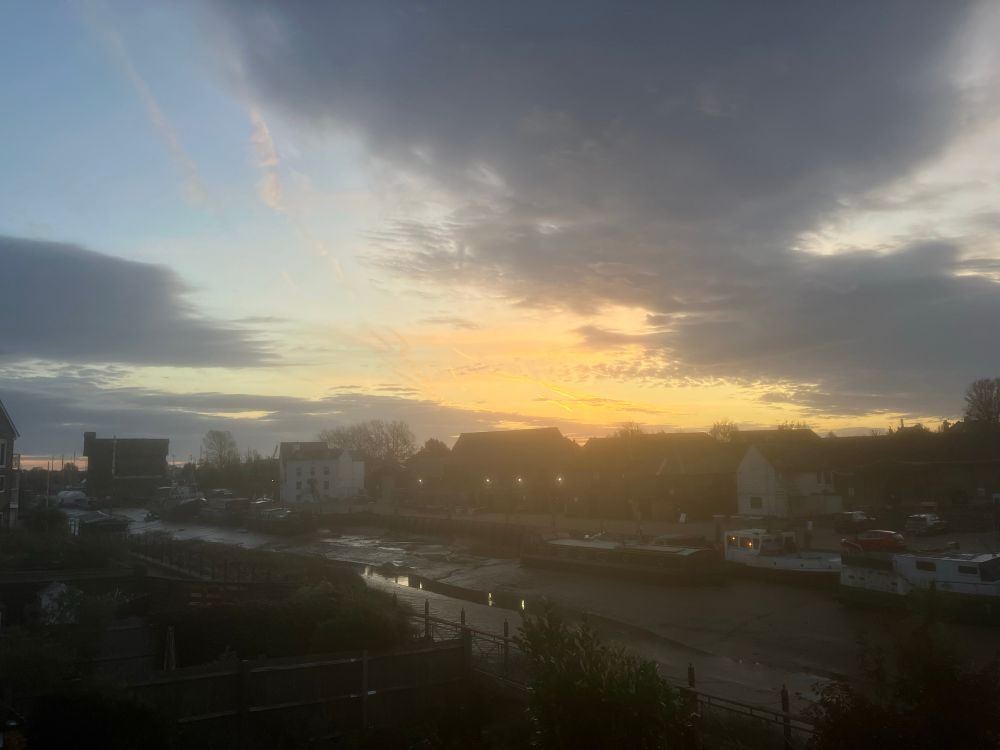 Sunrise over the buildings looking east over the creek