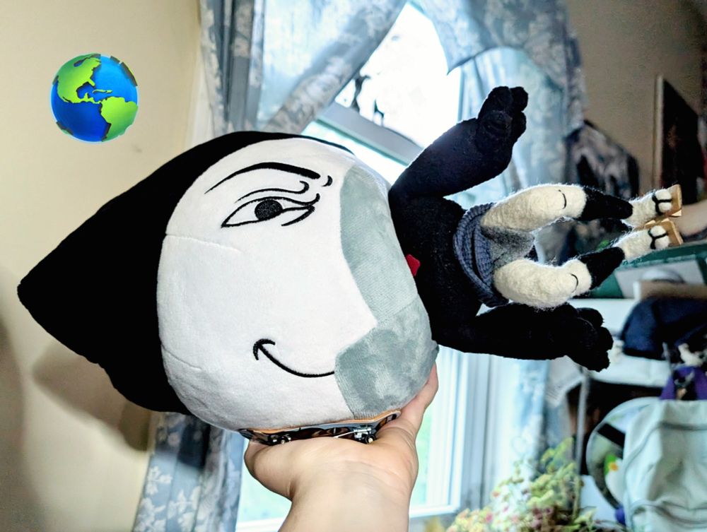 moony plushie with froggy art doll shoved inside
