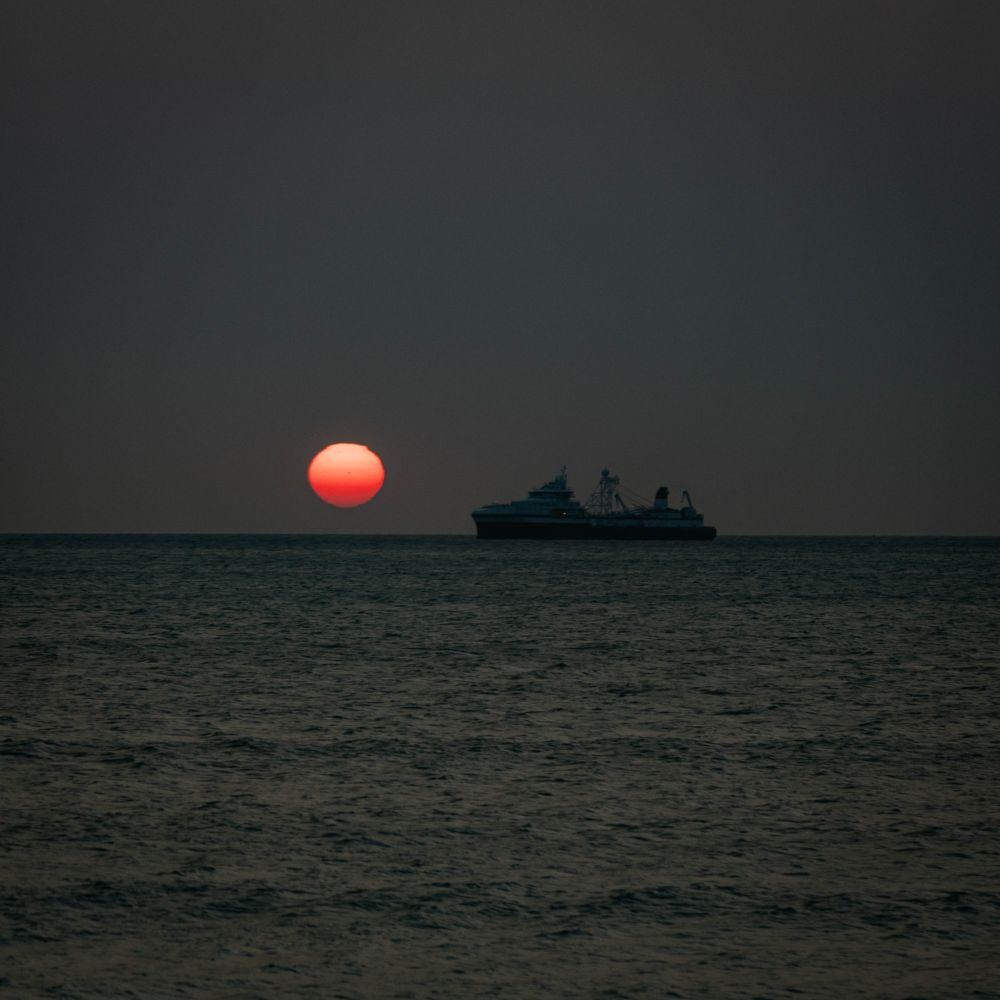 Sunset over Table Bay, Cape Town, with the fishing vessel Antarctic Endurance in the foreground.