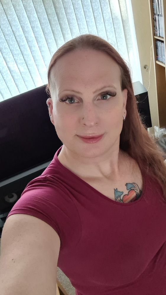 Long red-headed woman