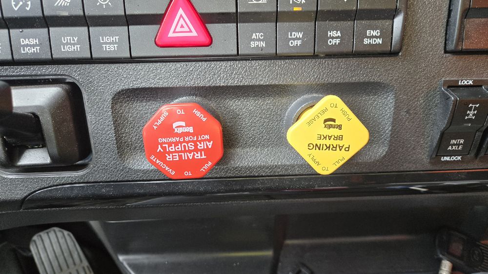 The air brake valves on a semi, and both the tractor and trailer buttons are upside down. 