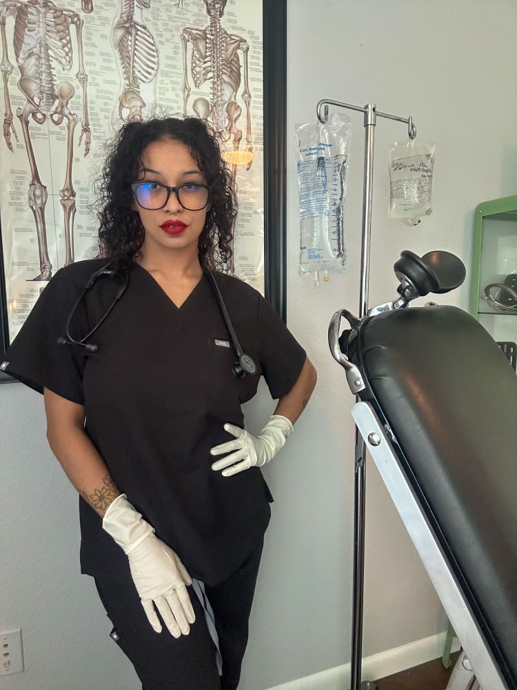 Doctor Raven Noxx waiting to begin the lengthy examination & treatment of her patient. 