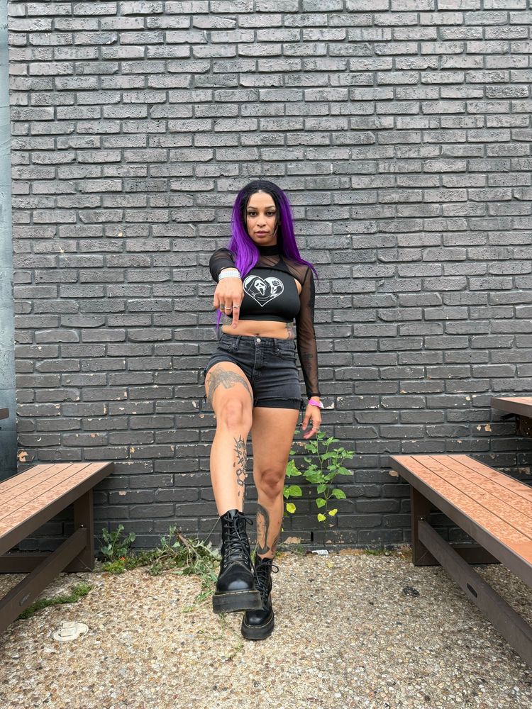 Mistress Raven Noxx offering up her sticky sweaty boot to her willing boot slut for cleaning 