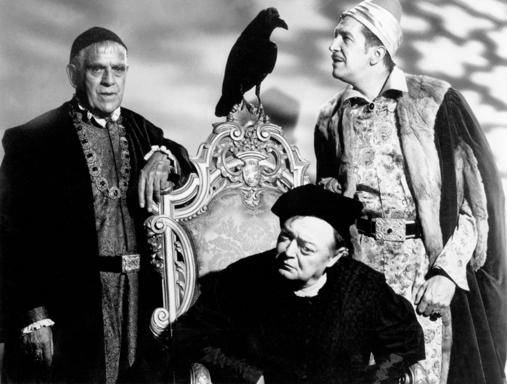 from left to right: boris karloff, peter lorre, and vincent price stand in elaborate costume. lorre sits on a chair, with a raven perched on top of it