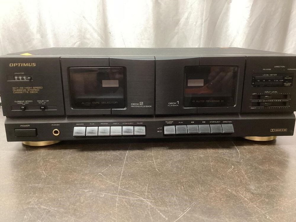 Close-up of a vintage dual cassette tape deck, once used to copy mixtapes and share music before digital file sharing platforms like Napster.