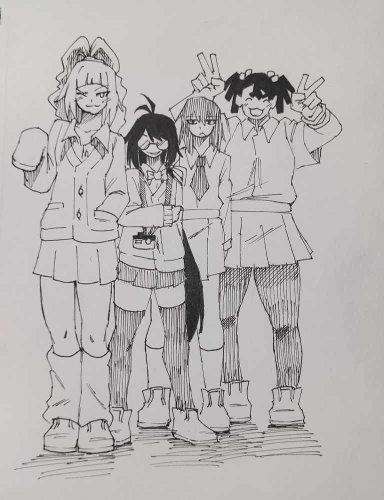 A group of 4 girls posing for a camera.