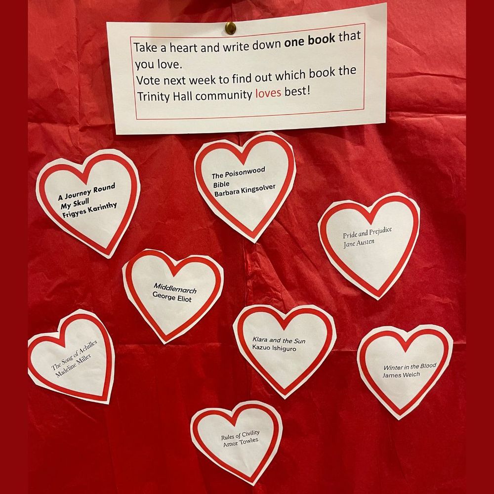 Red background with paper hearts containing details of books