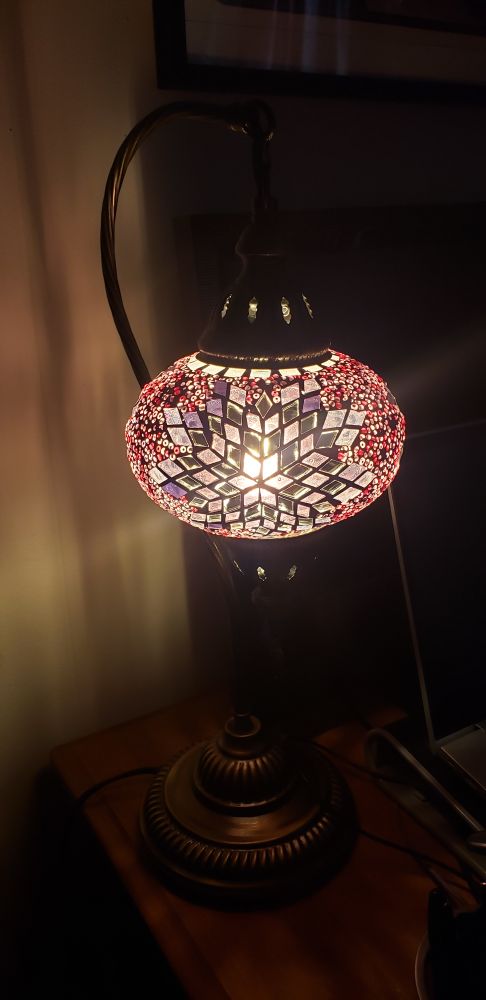 A pretty lamp of purple glass