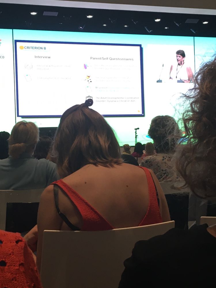 Bright screen in distance with speaker in corner 