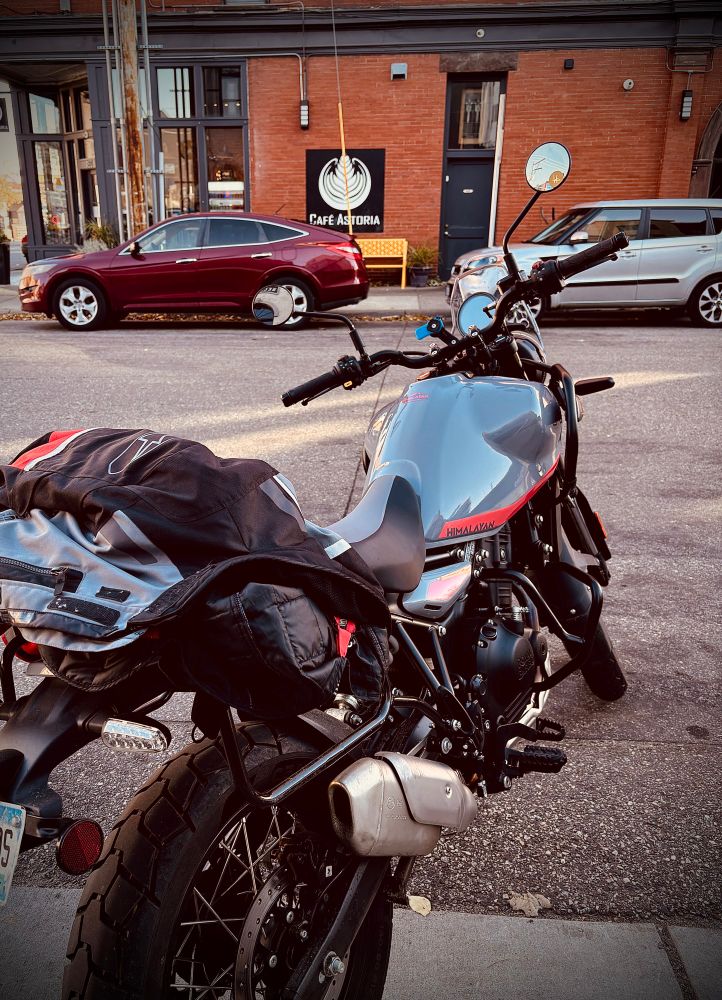 Motorcycle parked outside coffee shop