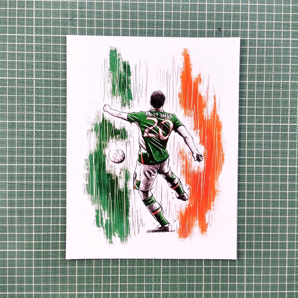 Print of an illustration of Wes Hoolahan volleying a football, wearing the #20 Ireland kit. Sitting on Green cutting Matte