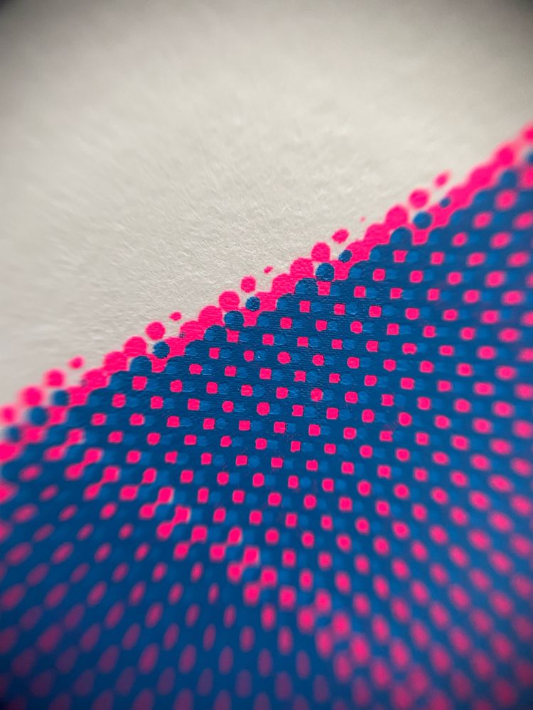 A macro image of the halftone of a screenprint
