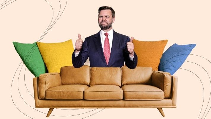 JD Vance giving a thumbs up from behind a couch, suspiciously only visible from the chest up