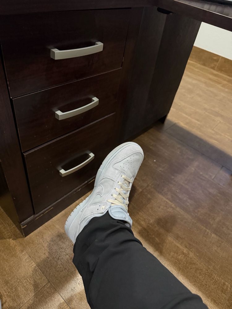 gray Nike dunks that are basically the Kirkland ones