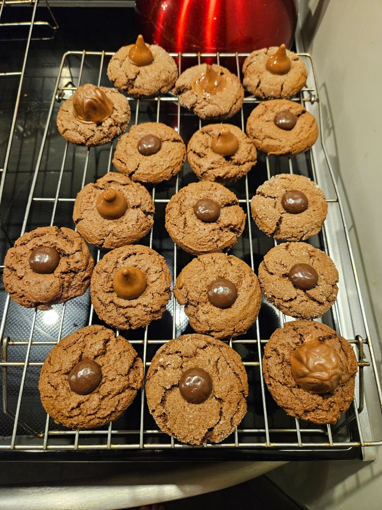 Chocolate cookies, some topped with Hershey kisses and some with junior mints. 