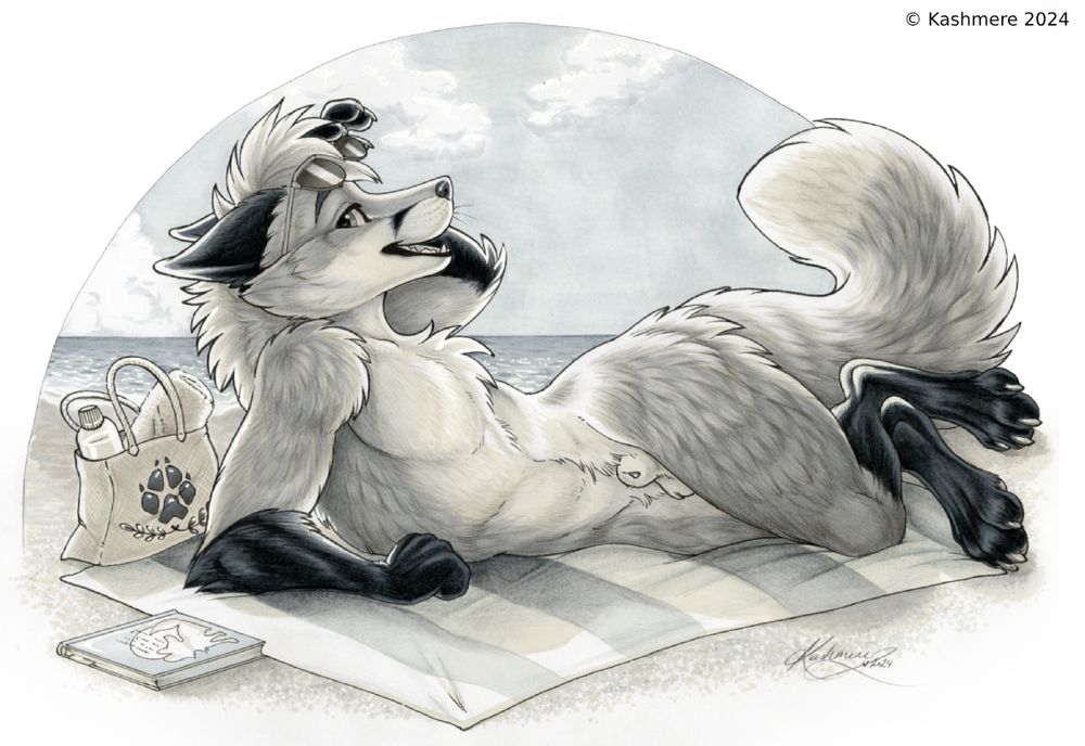 Nude fox looking over his shoulder while sunning, lifting his sunglasses