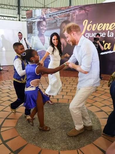 Prince Harry & Meghan dancing with children in Columbia.