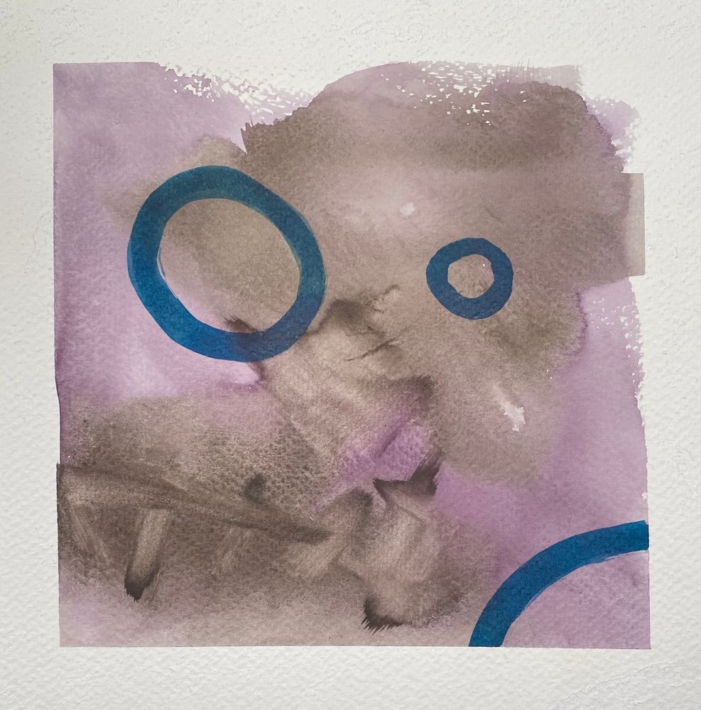 A purple and umber background with a medium blue circle in the upper left next to a smaller blue circle on the right.  In the lower right corner is a blue quarter circle.